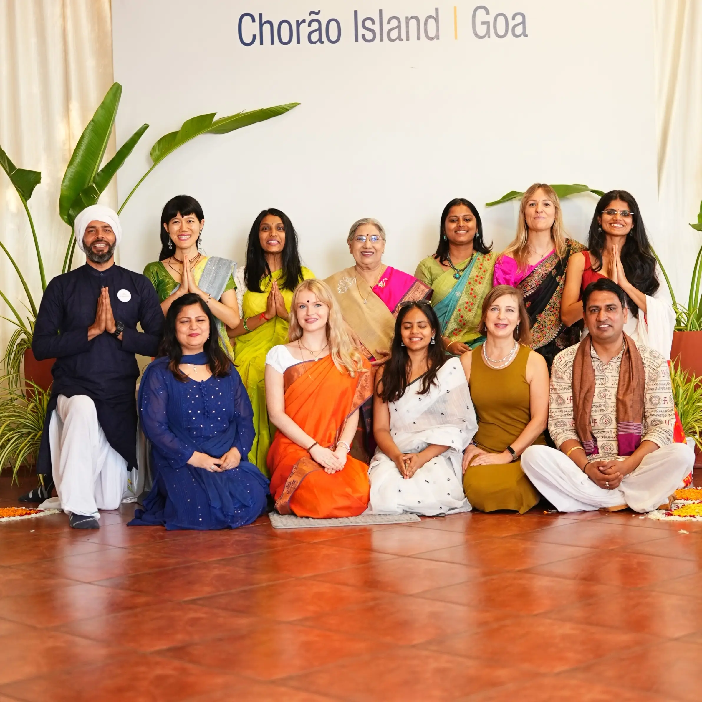 Yoga practitioners in prayer pose at The Yoga Institute Goa